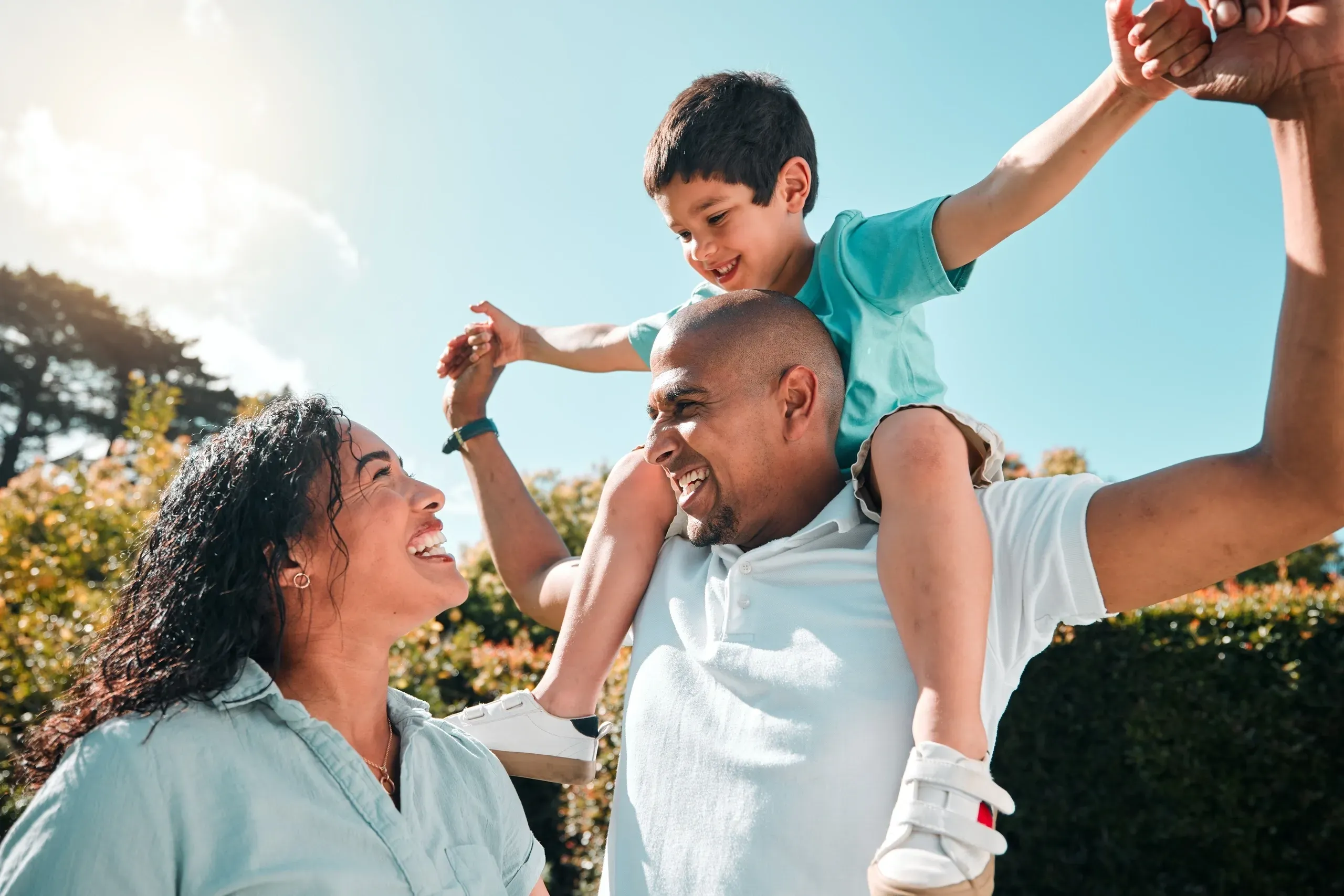 Joyful mixed-race family outdoors